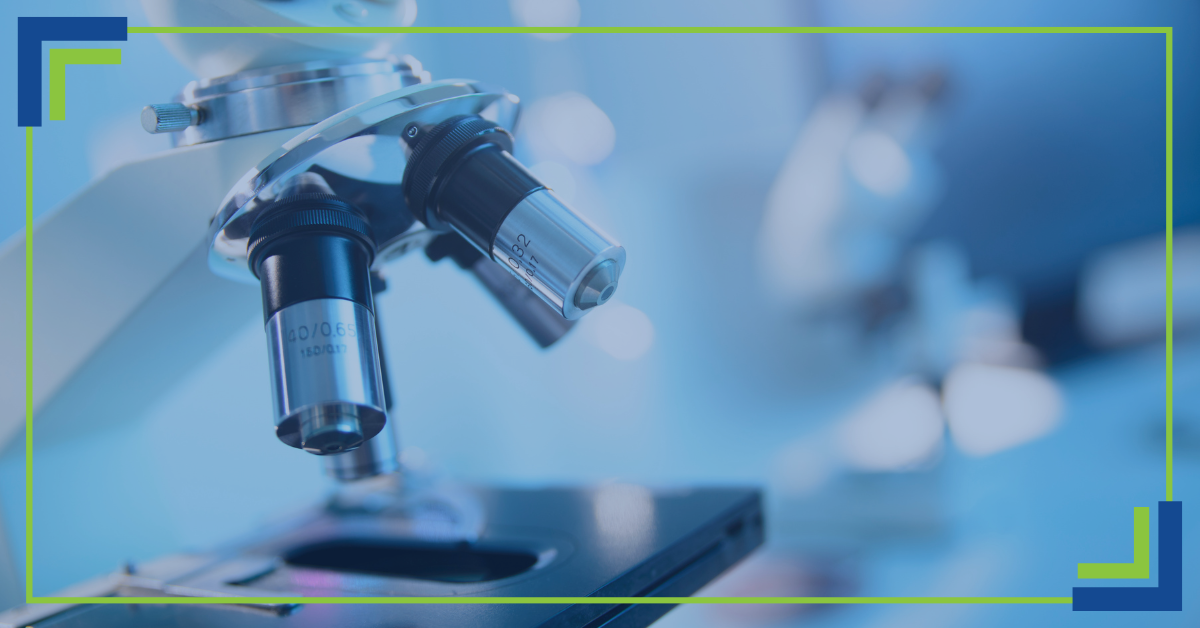 Decorative graphic that focuses on a microscope in the foreground