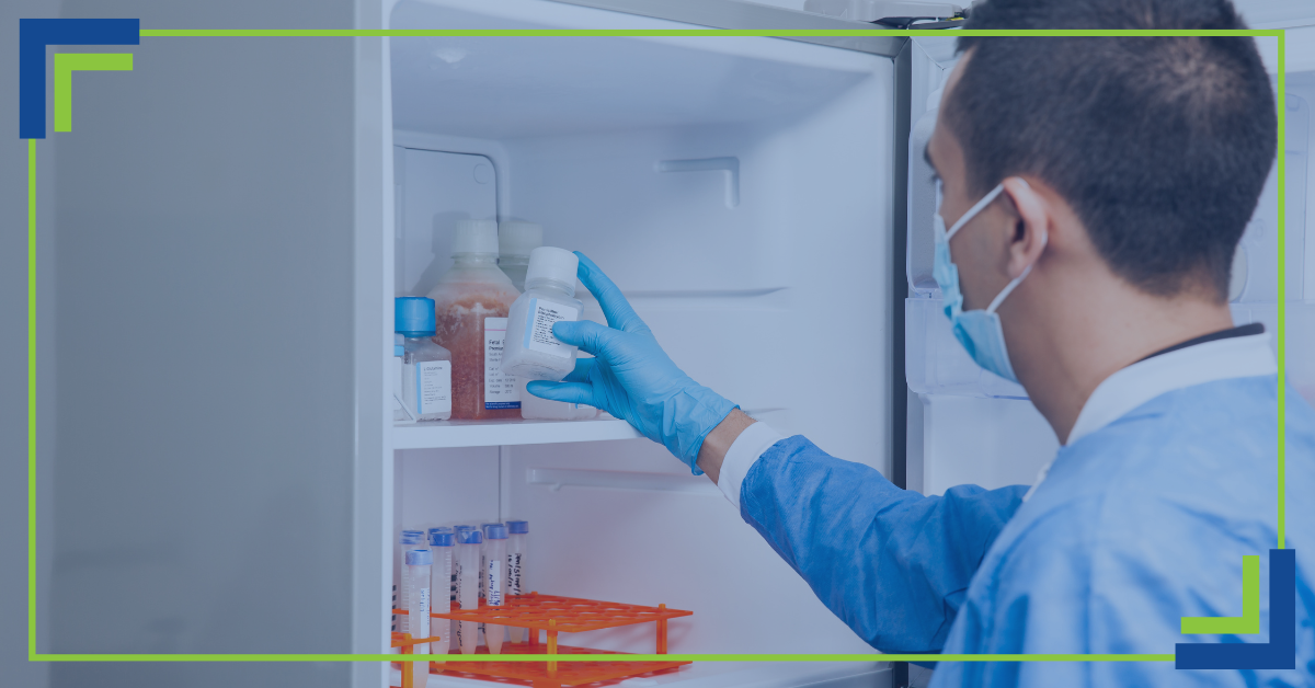 A scientist removing an item from a lab freezer